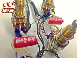 Les Paul Style Long Shaft Wiring Kit shown with Bumble Bee Capacitors